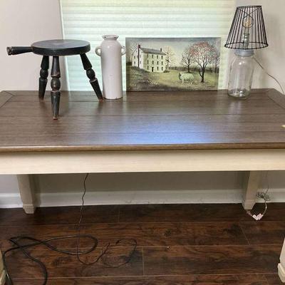 Wooden computer table with decorative accent items