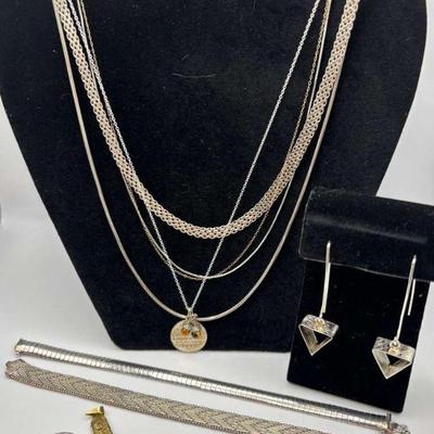 Silver jewelry set with earrings necklaces, and bracelets