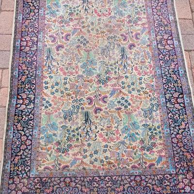 ORIENTAL STYLE RUG IN BLUES AND PINKS