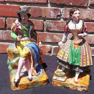 A PAIR OF PARIS ENAMELED PORCELAIN STATUE OF A LAD AND HIS LASSIE