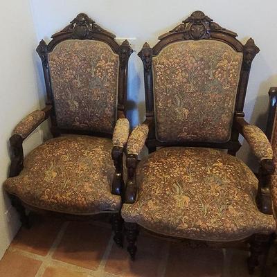 SOPHISTICATED PAIR OF AMERICAN HIGH VICTORIAN CARVED WALNUT ARM CHAIRS