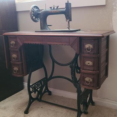 "NEW HOME" BRAND SEWING MACHINE AND SEWING TABLE