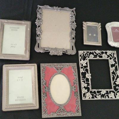 SEVEN SILVER-COLORED VINTAGE PICTURE FRAMES