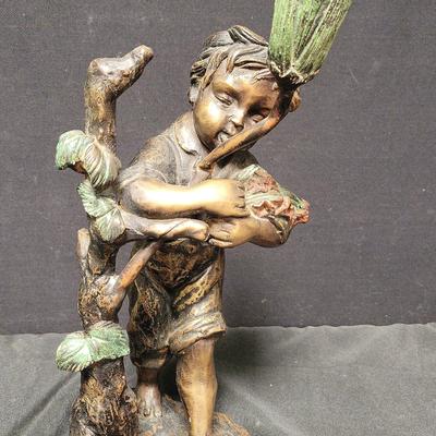 BRONZE SCULPTURE OF A BOY