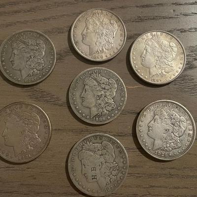 7 Morgan Silver Dollars – 1879, 1886, 1888, 1897, 1898, 1921 (x2) – Vintage U.S. Coins