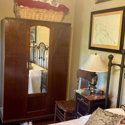 Armoire, marble topped night stands, lamp, map