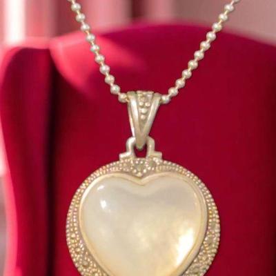 Heart in a circle pendant on a chain