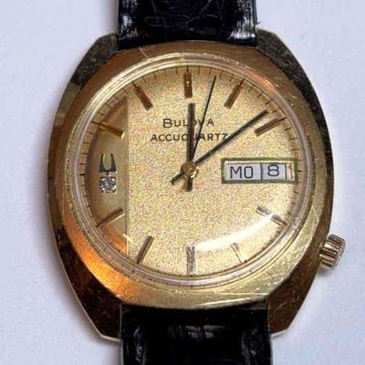 Bulova accuquartz 18k gold watch