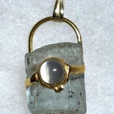 Aquamarine shard with moon stone cabochon