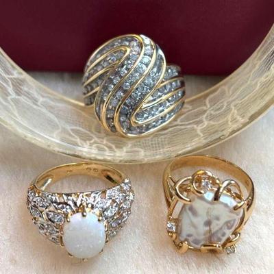 Trio of cocktail rings set in gold