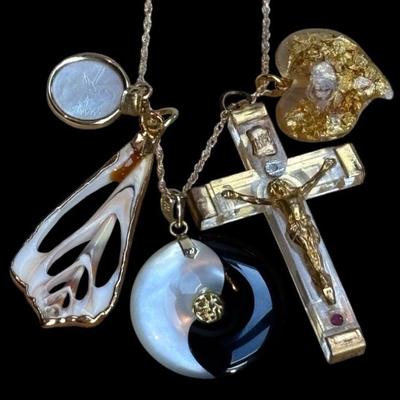 A collection of pendants with gold accents
