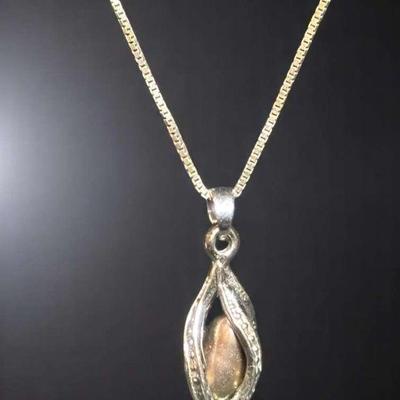 Caged pearl pendant on 14kt italian chain