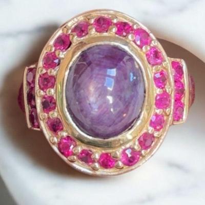 Star ruby ring with ruby accents set in 10k gold