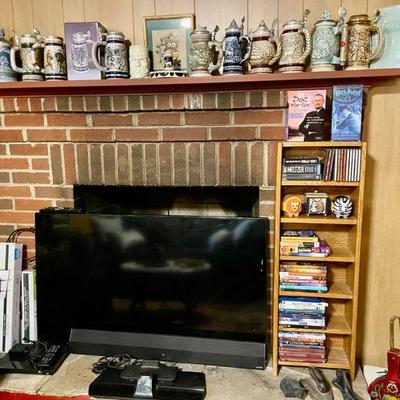Collection of vintage Avon steins & 50" Smart TV