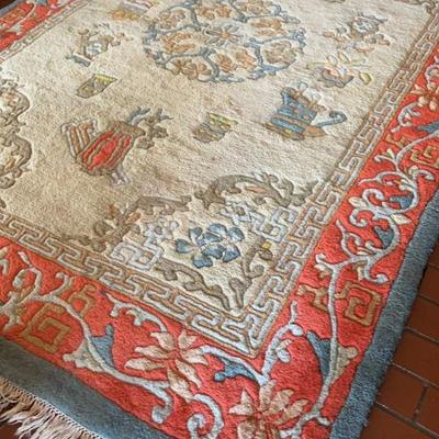 Large Area rug possibly Turkish hand woven in tan,peach, baby blue floral design with fringes