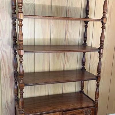 Wood bookcase with carved wood by Ferguson Fine furniture
