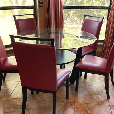 Glass Dinning Table With Five Black And Red Chairs and Extra Glass Top