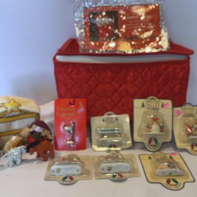 Satin Red Christmas Storage filled with fun little animals, & A Wonderful Holiday Figurines 