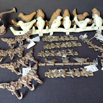 Collection of wrought iron hooks and decorative pieces
