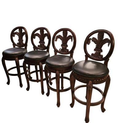 Set of 6 Nice, heavy bar stools with leather seats .(only 4 pictured)