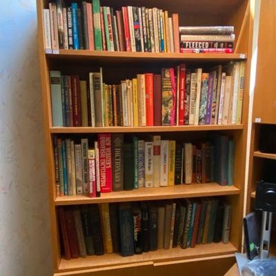 oak bookcase loaded with books