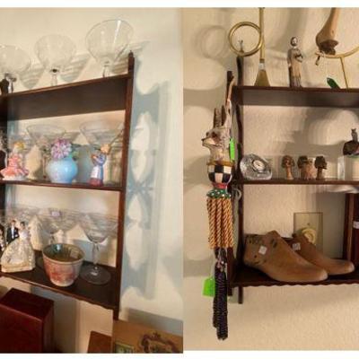 pair of mahogany shelves filled with treasures