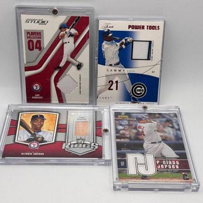 (4) Pieces Of Jersey Baseball Cards Feat - Manny Ramirez
