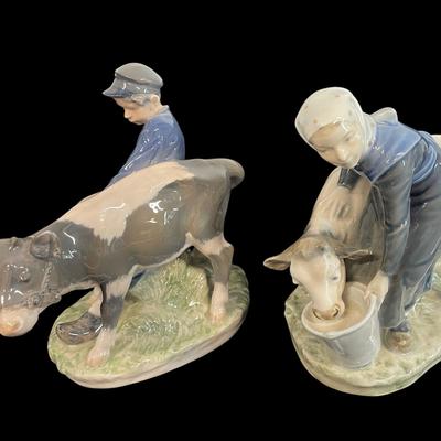 BO204 - Pair of Royal Copenhagen Figurines – Boy with Calf #772 & Girl Feeding Calf #779