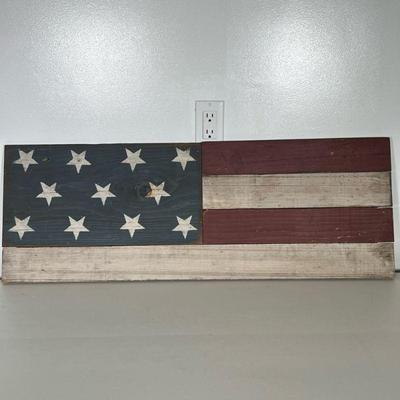 Americana Carved Wood Flag Wall Art | Hand-made American hanging wood flag decor. 11 stars and 4 stripes. Dimensions: h. 13 x l. 36 in
