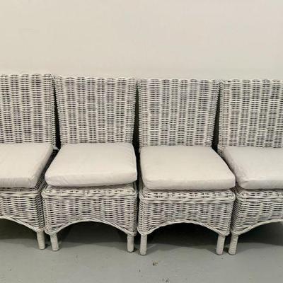 (8pc) WHITE WICKER DINING CHAIRS | Including two armchairs and six side chairs, with cushions; seat h. 17.5 in. (without cushion). - h....