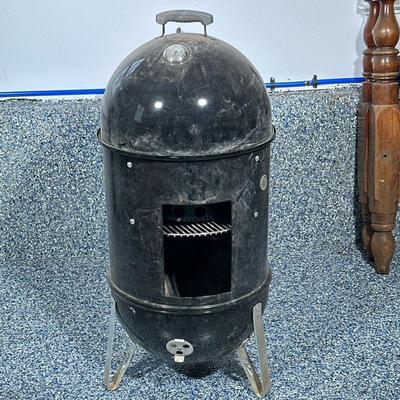 WEBER SMOKER MOUNTAIN COOKER | Weber black Smokey mountain cooker grill. Includes cover. Dimensions: h. 43 x w. 18 in