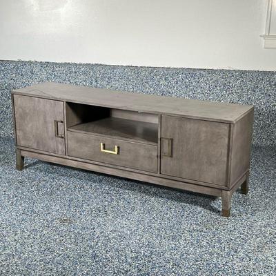 DISTRESSED GRAY MEDIA CONSOLE CABINET | Grey console cabinet with 2 cabinets and center drawer with brass pulls. - h. 23 x w. 63 x d. 16 in
