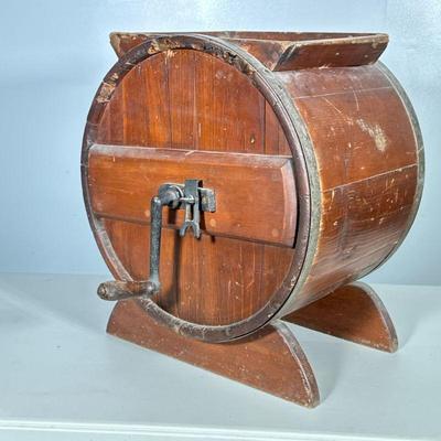 Butter Churn | Metal rimmed antique hand cranked churn barrel. Includes crank. Dimensions: h. 20 x w. 17 x d. 13 in