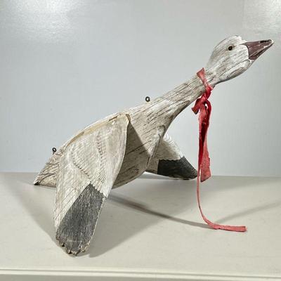 CARVED WOOD GOOSE | Carved wood & painted hanging goose. Dimensions: h. 11 x w. 22 x l. 30 in
