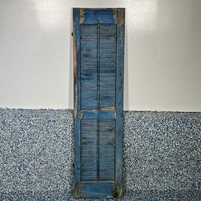 ANTIQUE HOUSE SHUTTER | Distressed blue painted shutter, 3 pieces of old hardware still attached. Dimensions: h. 55.5 x w. 14 in

