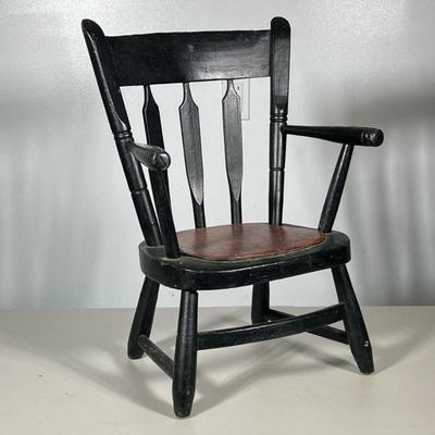 Spindle Carved Windsor Child’s Chair | Black painted spindle carved child's chair, formerly a potty chair. - h. 21 x w. 15 x d. 11.5...