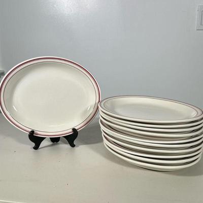 (11pc) Homer Laughlin Oval Diner Plates | Oval with red trim plates by Homer Laughlin. Dimensions: w. 9 x l. 11 in