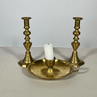 (3pc) Brass Candlesticks | Including; a pair of turned brass candlesticks, and brass candle holder. Dimensions: h. 9 x w. 3 in...