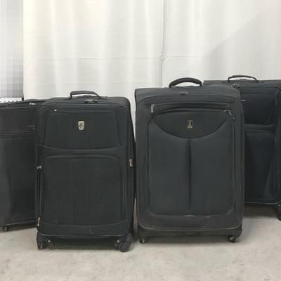 Four Large Travel Spinner Suitcases 