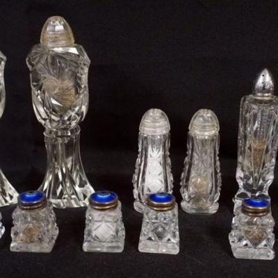 1147	ASSORTMENT OF CUT AND PRESSED GLASS SALT & PEPPERS 6 WITH BLUE ENAMEL AND STERLING LIDS, MARKED NORWAY, TALLEST APPROXIMATELY 7...