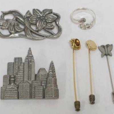 1103	ASSORTED LADIES JEWELRY INCLUDING 5 STICK PINS, 3 DESINGER PINS INCLUDING 2 SEAGULL PEWTER AND STERLING SILVER SPOON RING...