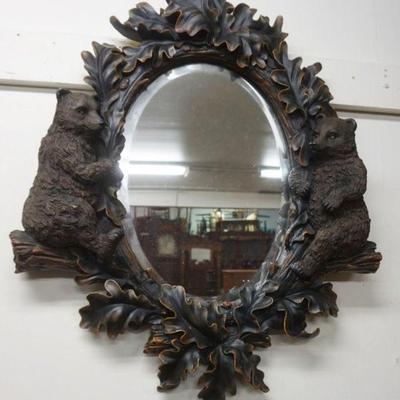 1219	HANGING BEVELED EDGE MIRROR WITH COMPOSITE FRAME HAVING OAK LEAVES AND BEAR CUBS, APPROXIMATELY 23 IN X 27 IN
