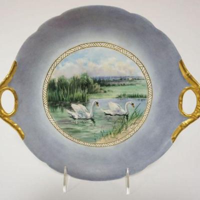 1033	JP LIMOGES FRANCE HAND PAINTED PLATE, DOUBLED HANDLED W/SWANS IN WATER ALONG FIELD W/GILT EDGE, APPROXIMATELY 10 IN 12 IN
