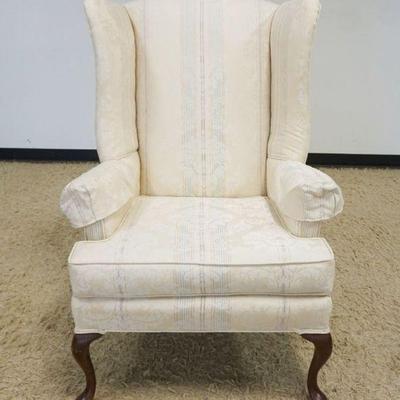 1208	UPHOLSTERED WING CHAIR, APPROXIMATELY 30 IN X 27 IN X 44 IN H
