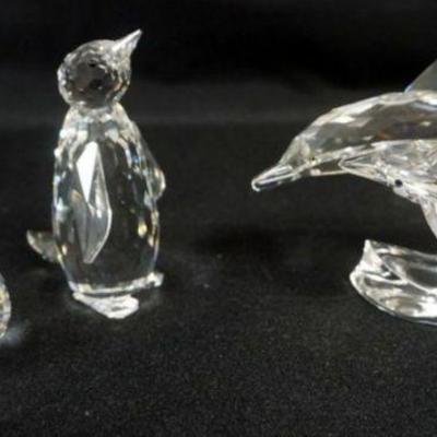 1088	SWAROVSKI CRYSTAL FIGURES, WHALE, PENGUIN AND DOUBLE DOULPHIN, TALLEST APPROXIMATELY 5 IN X 3 IN
