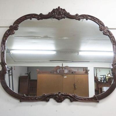 1218A	HANGING MIRROR IN ORNATE CARVED MAHOGANY FRAME, APPROXIMATELY 30 IN X 41 IN H

