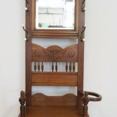 1183	CARVED WALNUT VICTORIAN HALL RACK WITH BRASS COAT & HAT HANGERS, TURNED SPINDLE GALLERY AND CENTER, APPROXIMATELY 32 IN X 15 IN...