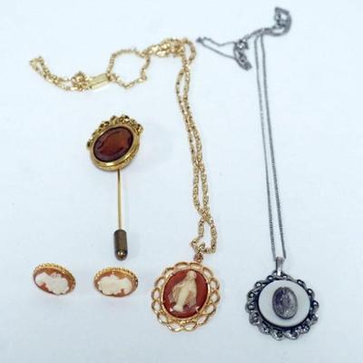1097	ASSORTED CAMEOS INCLUDING STERLING RELIGIOUS NECKLACE, CAMEO STICK PIN, CAMEO EARRING AND CAMEO COSTUME NECKLACE
