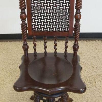 1184	UNUSUAL MAHOGANY HIGH BACK SWIVEL PIANO STOOL WITH TURNED SIDES AND BASE, PAW FEET AND WOOD WOVEN CENTER BACK, APPROXIMATELY 16 IN X...