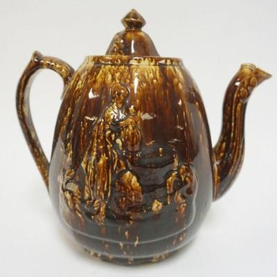 1075	ROCKINGHAM LARGE REBECCA AT THE WELL TEA POT, APPROXIMATELY 12 IN H, CHIP ON LID
